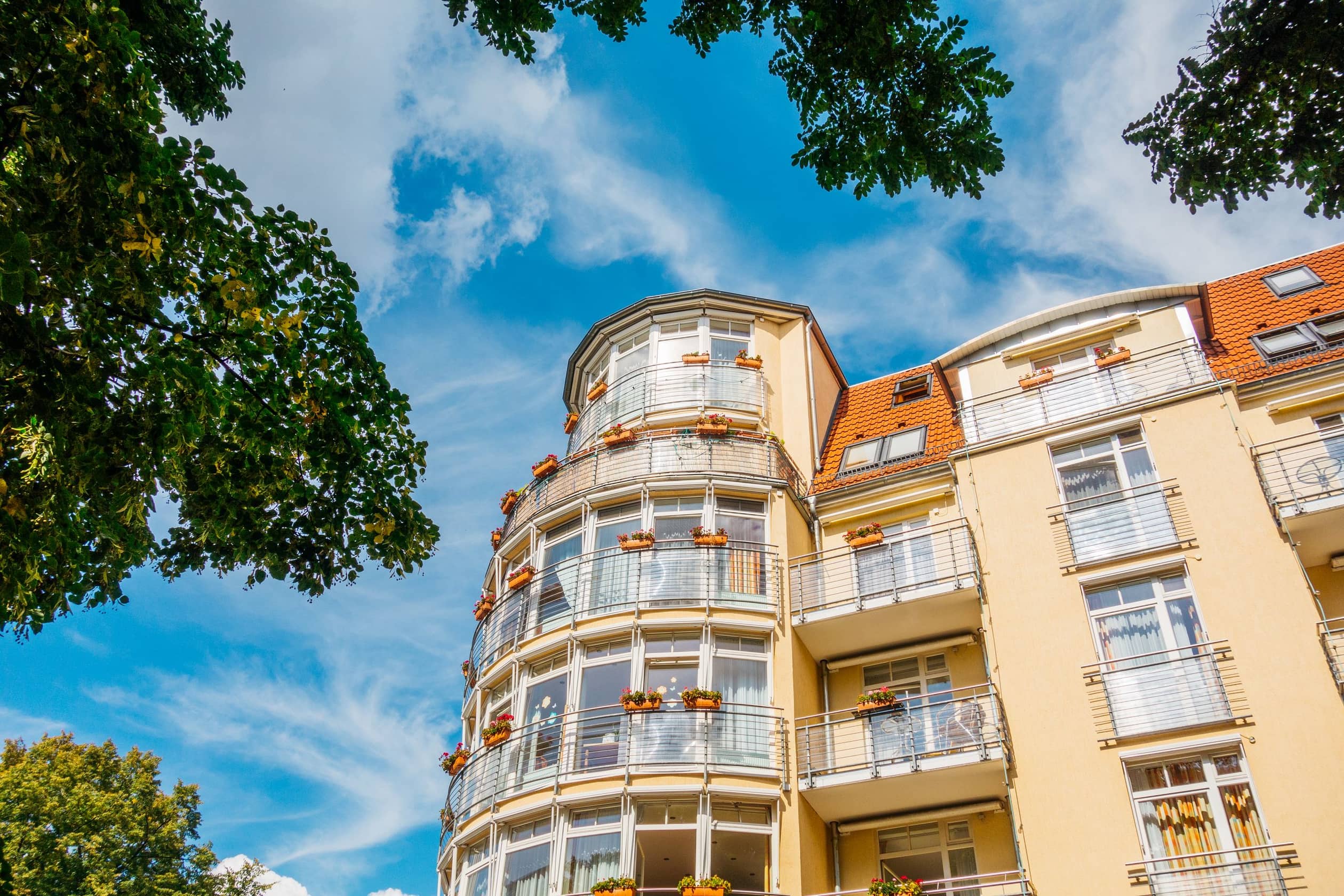 modern corner building with orange facade 2025 10 07 01 02 13 utc