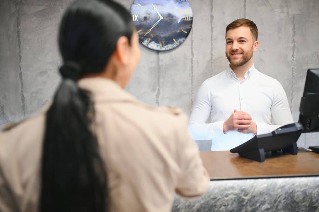 picture of guests getting key card in hotel