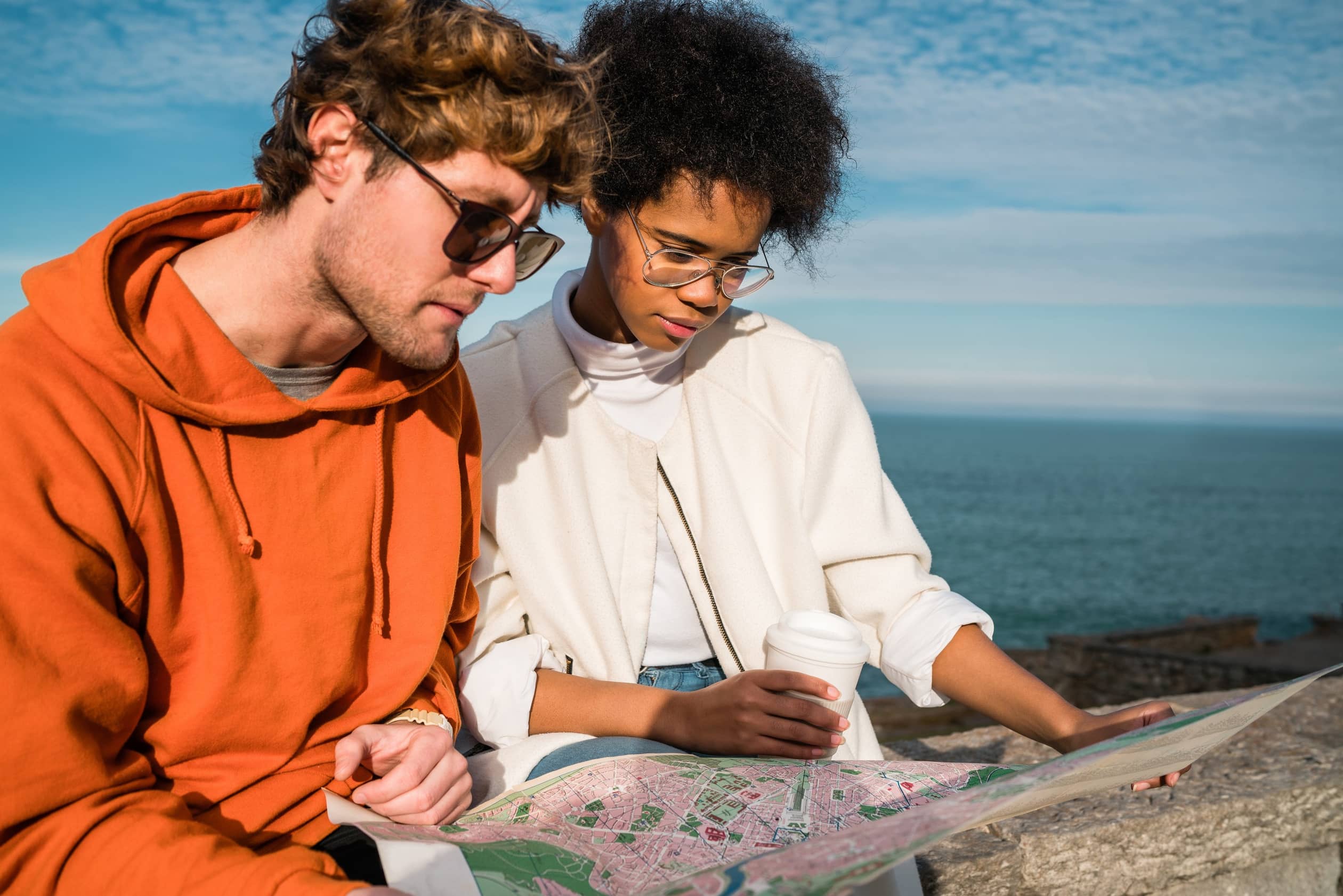 two travelers with a map 2024 10 15 04 38 26 utc